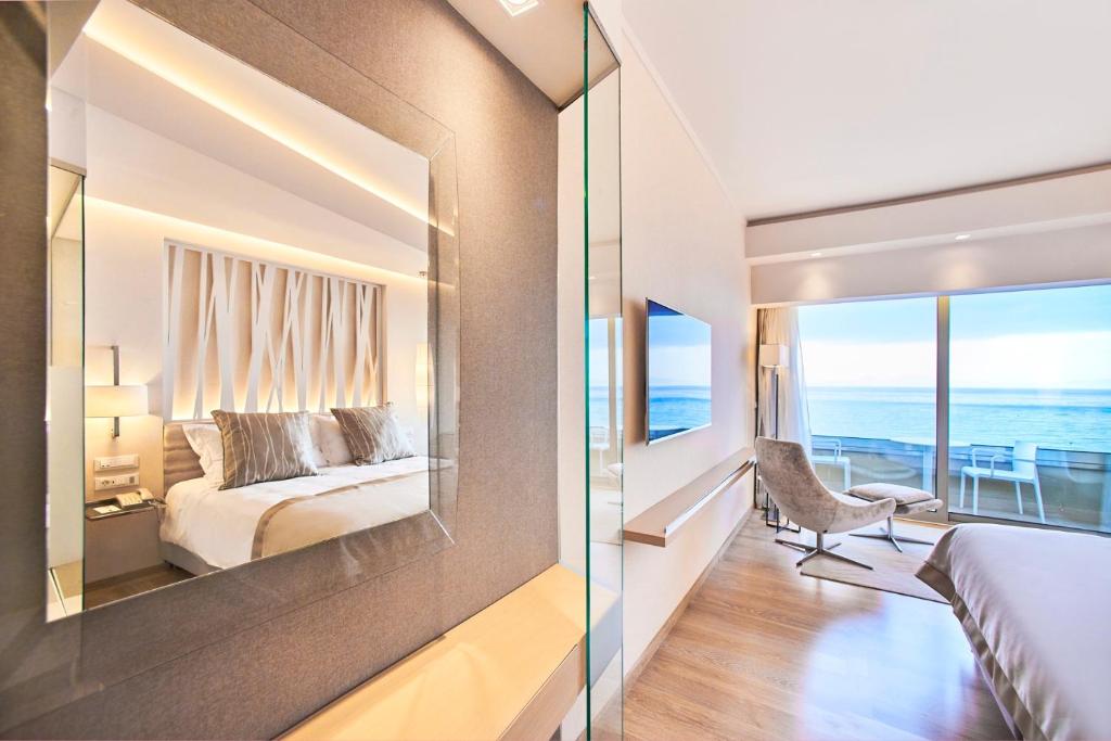 Postel nebo postele na pokoji v ubytování Rodos Palace Hotel