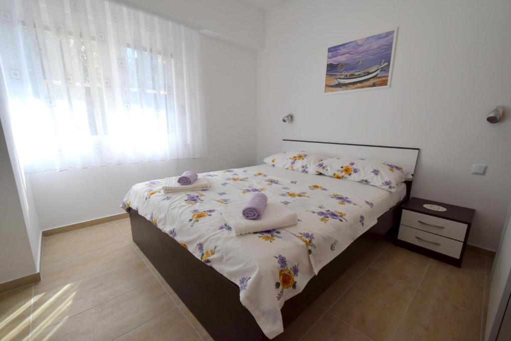 Postel nebo postele na pokoji v ubytování Apartments Buturajac