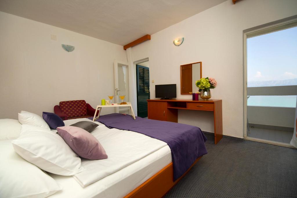 Postel nebo postele na pokoji v ubytování Hotel Faraon