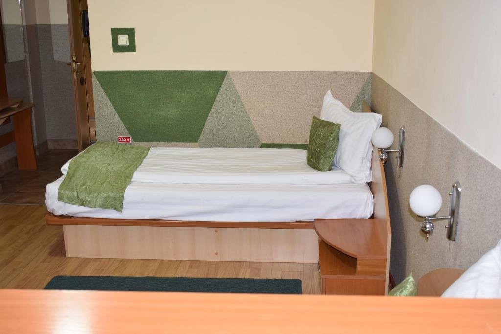 Postel nebo postele na pokoji v ubytování Hotel Zimbru