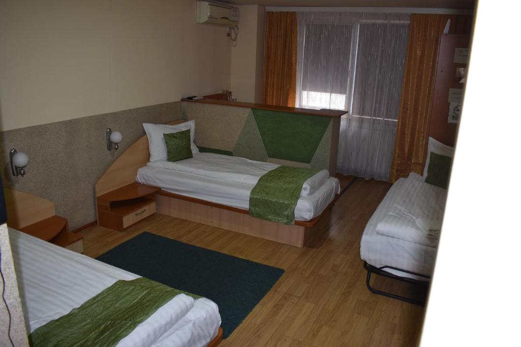 Postel nebo postele na pokoji v ubytování Hotel Zimbru