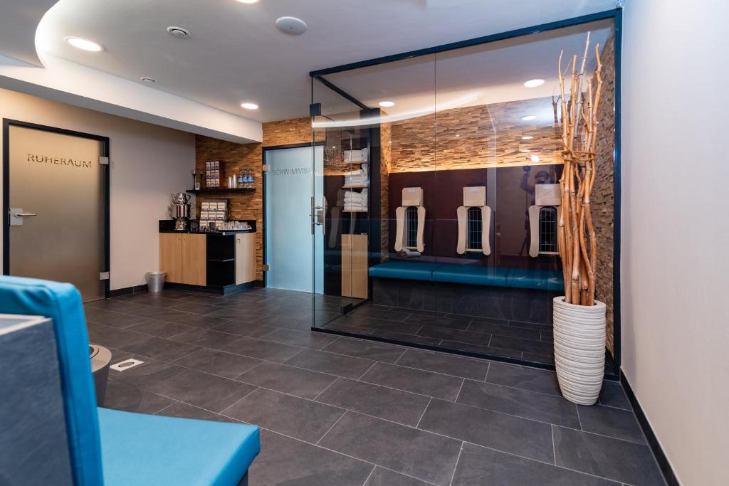 a lobby of a store with a vase on the wall at Hotel & Gasthof Richard Held in Regensburg