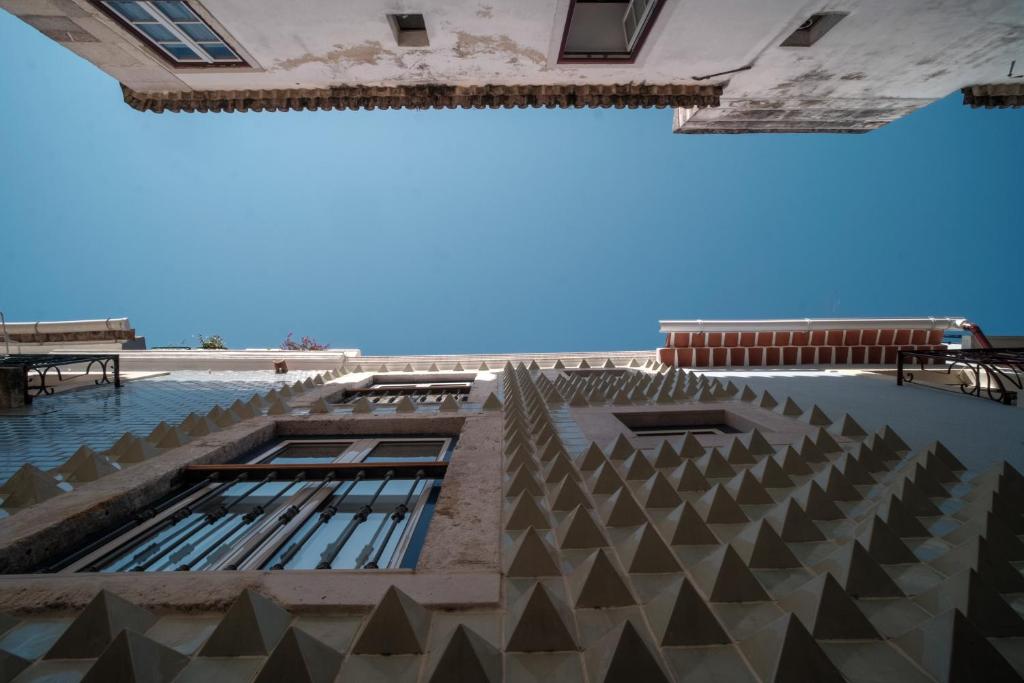 a view of a building with a swimming pool at Friendly Border City Design Apartments in Lisbon