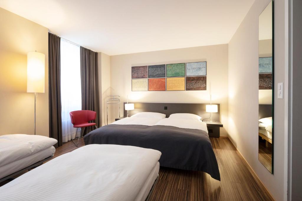 Llit o llits en una habitació de Altstadt Hotel