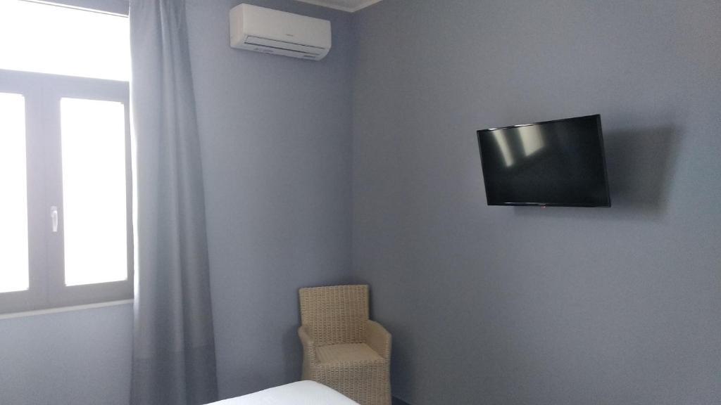 TV a/nebo společenská místnost v ubytování B&B Vecchia Darsena
