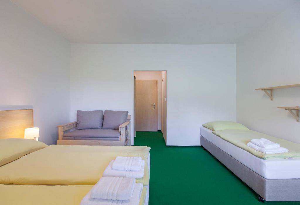 Postel nebo postele na pokoji v ubytování Hotel Rusava