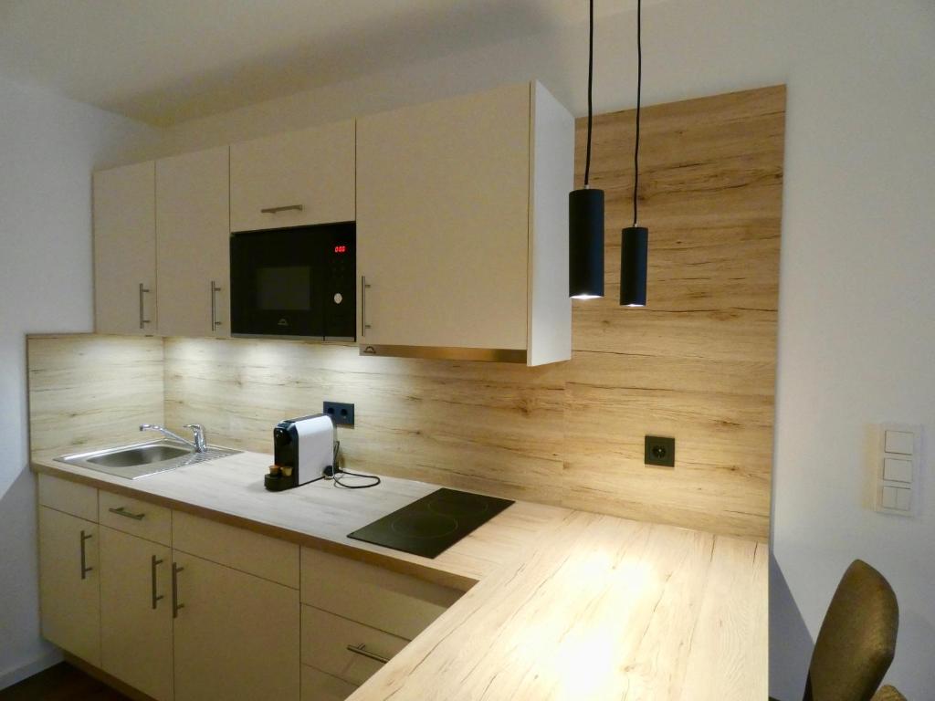 Kuchyň nebo kuchyňský kout v ubytování Living Hallertau