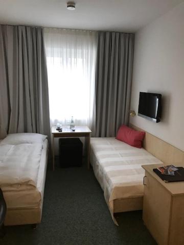Postel nebo postele na pokoji v ubytování Hotel Occam