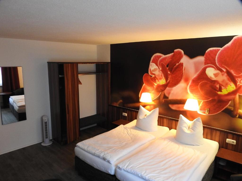 Postel nebo postele na pokoji v ubytování Hotel Anhalt