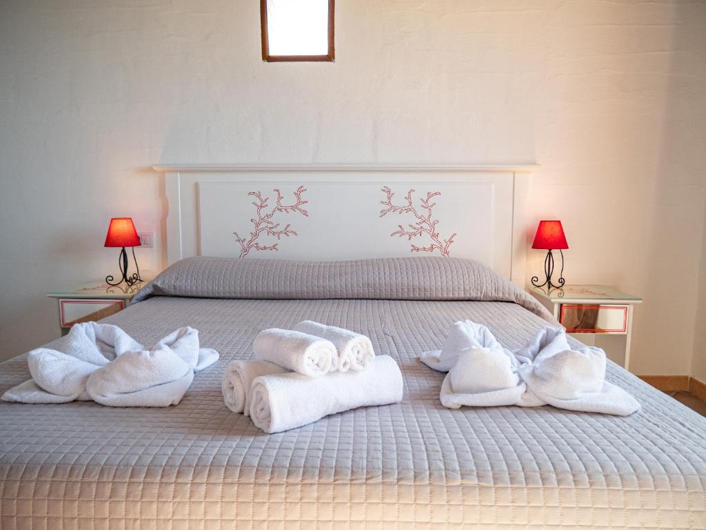 A bed or beds in a room at Il Tramonto Tanca Piras