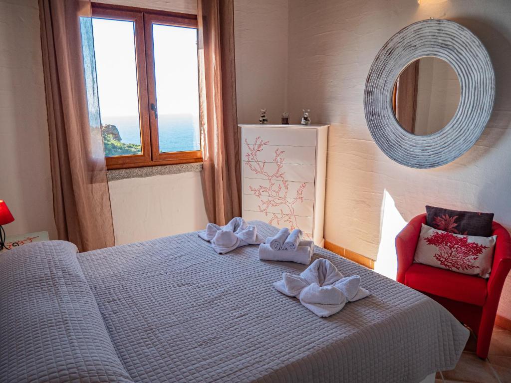 A bed or beds in a room at Il Tramonto Tanca Piras