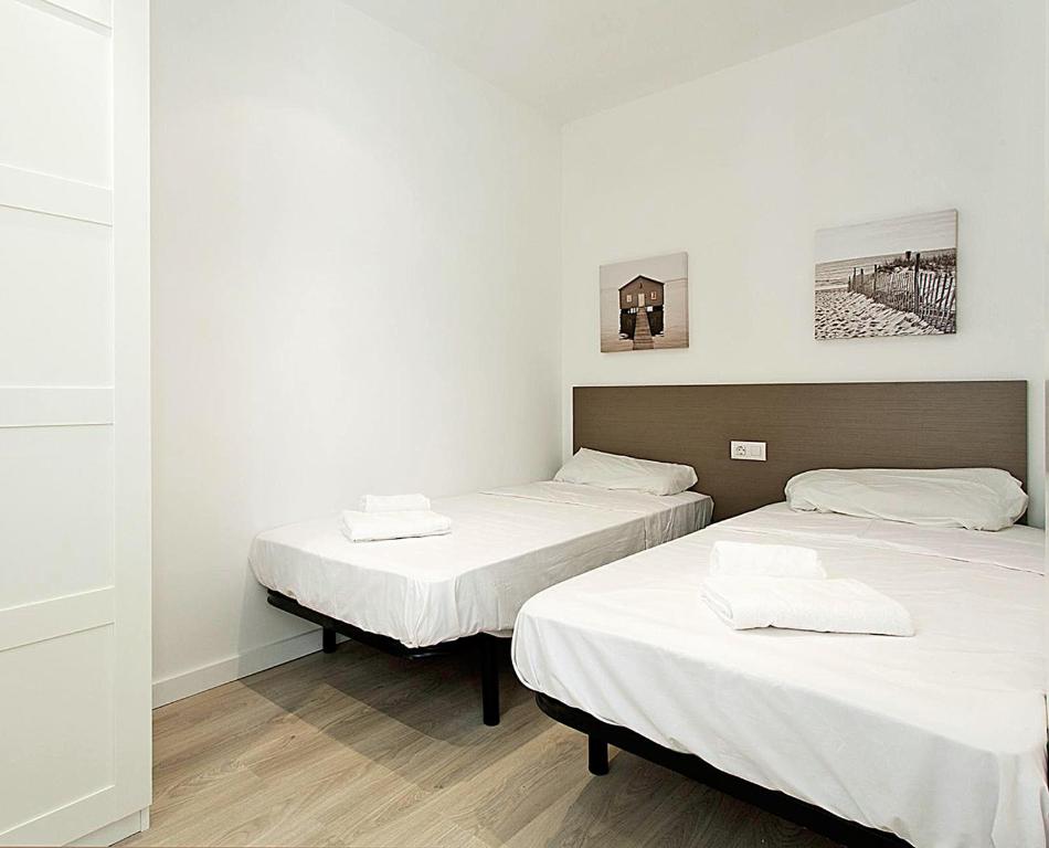 Posteľ alebo postele v izbe v ubytovaní MA22 · MA22 - Apartment in Sants communal terrace