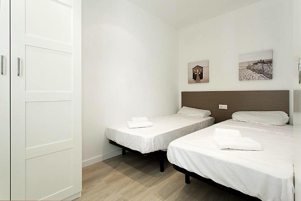 Posteľ alebo postele v izbe v ubytovaní MA22 · MA22 - Apartment in Sants communal terrace