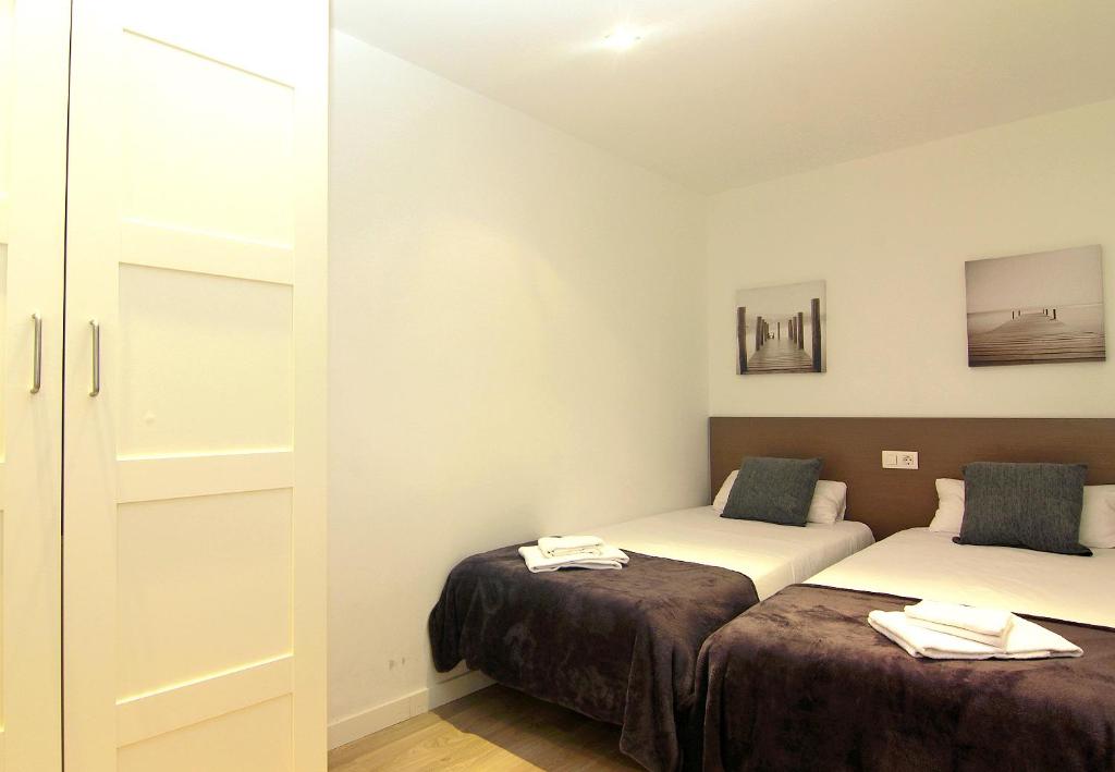 Posteľ alebo postele v izbe v ubytovaní MA22 · MA22 - Apartment in Sants communal terrace