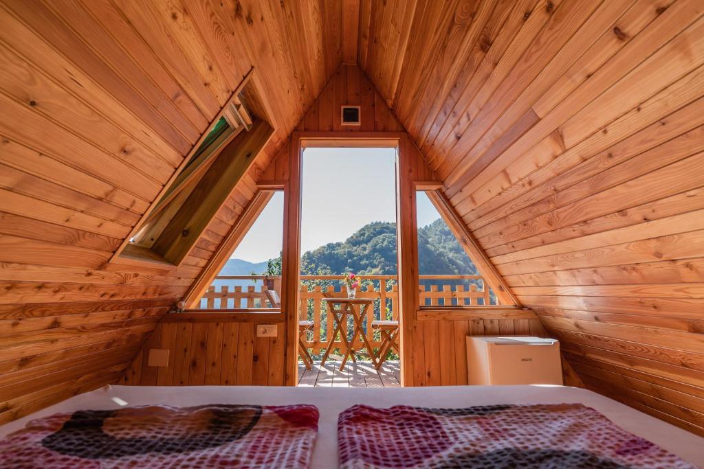 A bed or beds in a room at Glamping Tinka