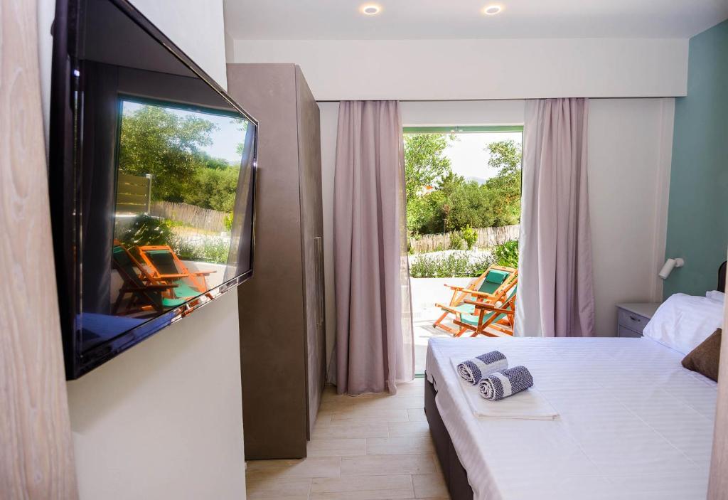 Postel nebo postele na pokoji v ubytování tzogias apartments pan