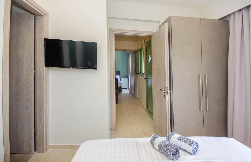 Postel nebo postele na pokoji v ubytování tzogias apartments pan