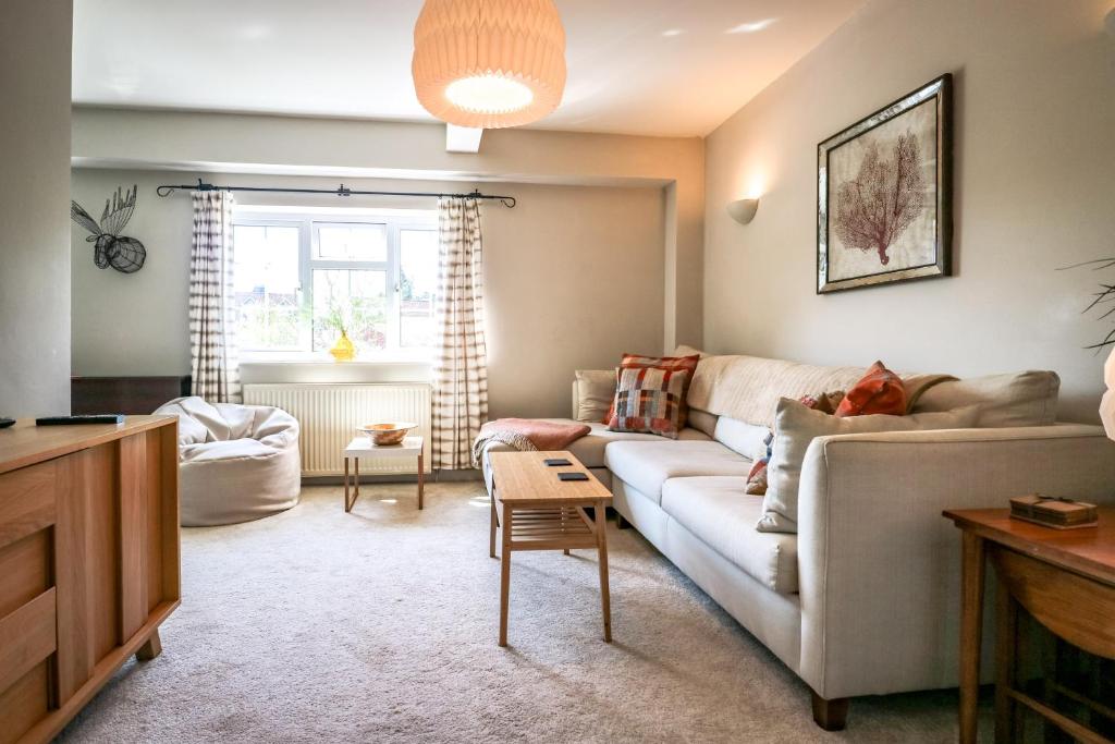 a living room with a couch and a table at The Beeches Holiday Homes in Oakhill