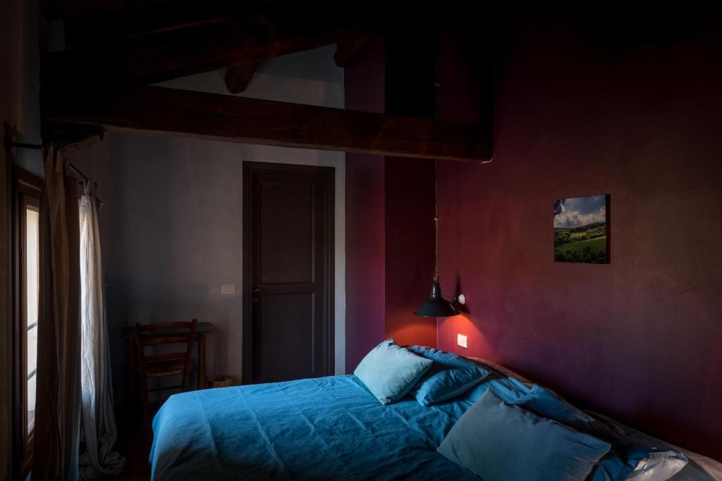 Postel nebo postele na pokoji v ubytování Foresteria San Rocco Borgoluce