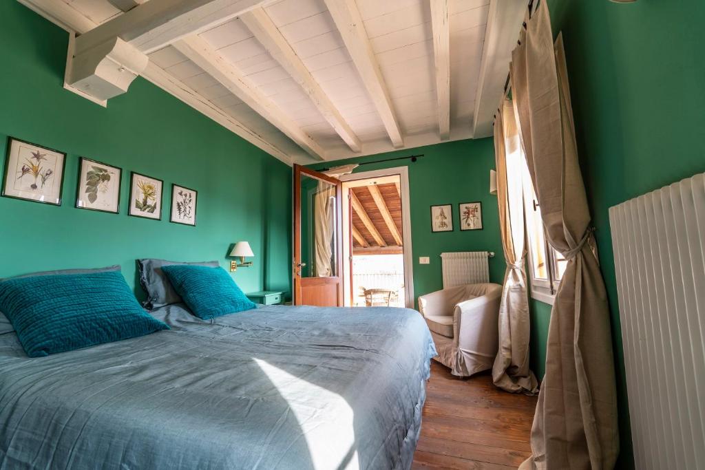 Postel nebo postele na pokoji v ubytování Foresteria San Rocco Borgoluce