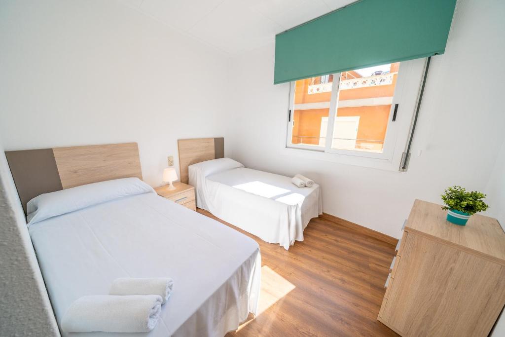Posteľ alebo postele v izbe v ubytovaní HomeHolidaysRentals Moana