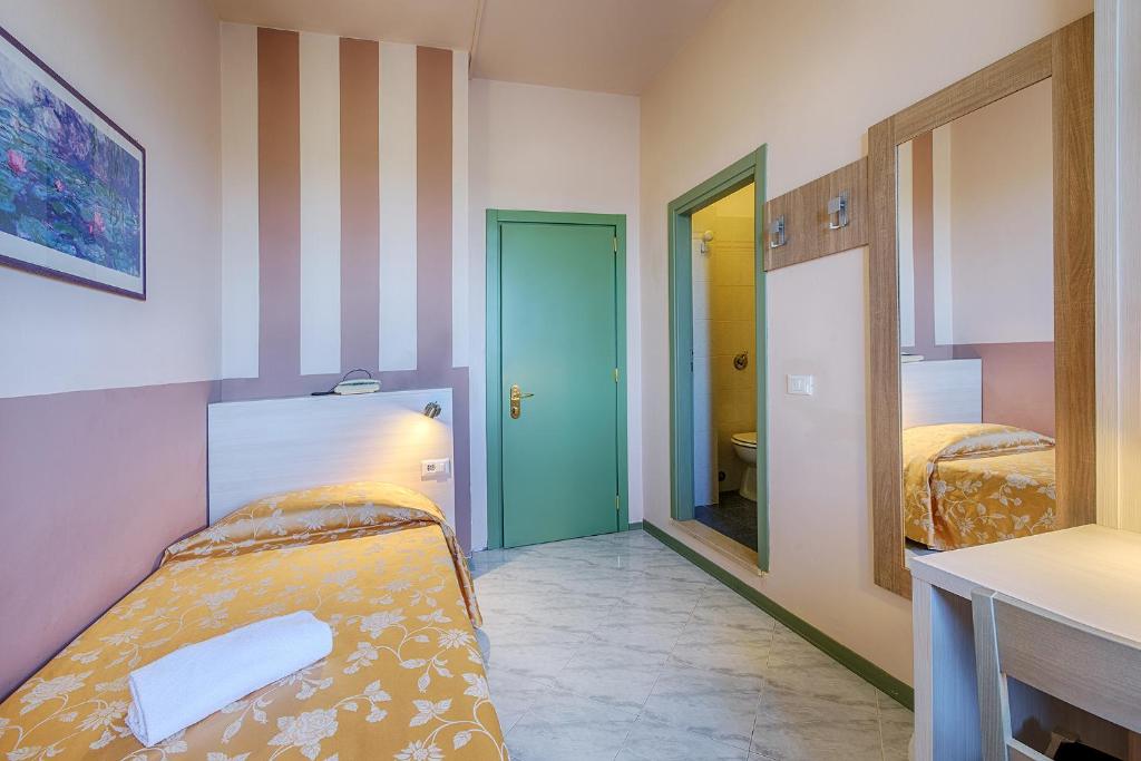 Postel nebo postele na pokoji v ubytování Hotel Castello