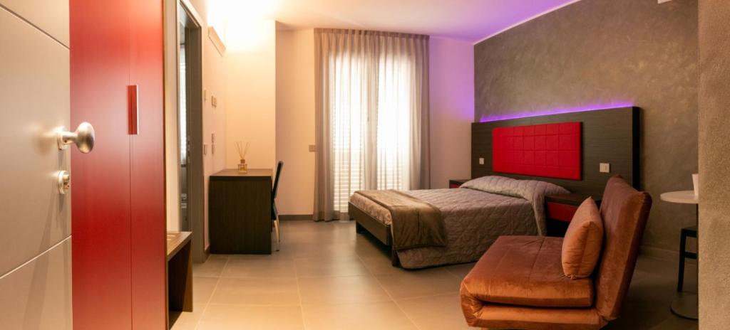 Postel nebo postele na pokoji v ubytování BRIGANTE SUITES