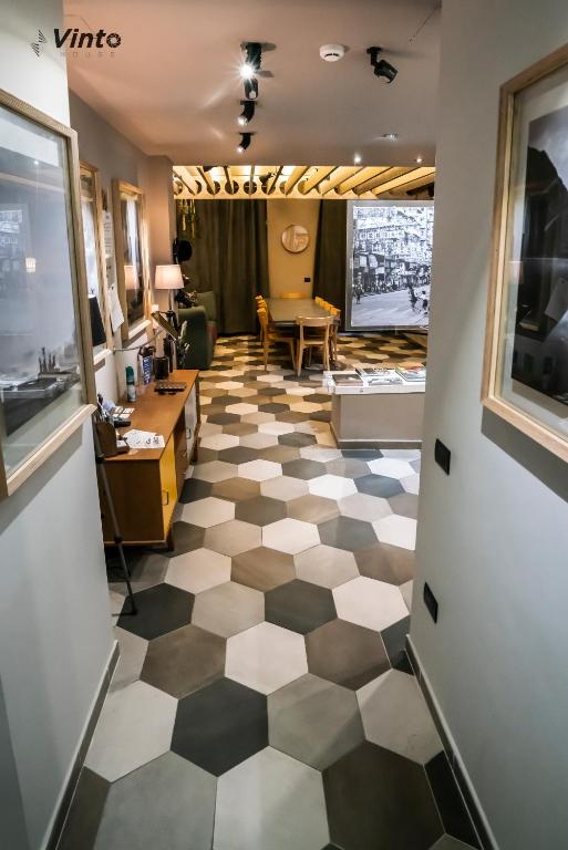 a living room with a checkered floor at Vinto House Salerno Downtown in Salerno