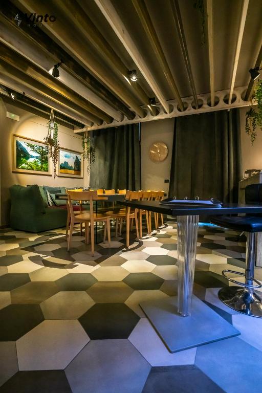 a dining room with a table and chairs at Vinto House Salerno Downtown in Salerno