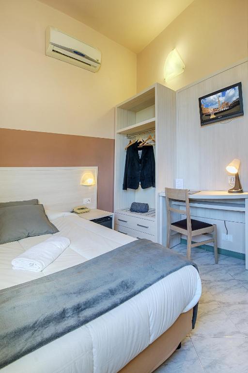 Postel nebo postele na pokoji v ubytování Hotel Castello