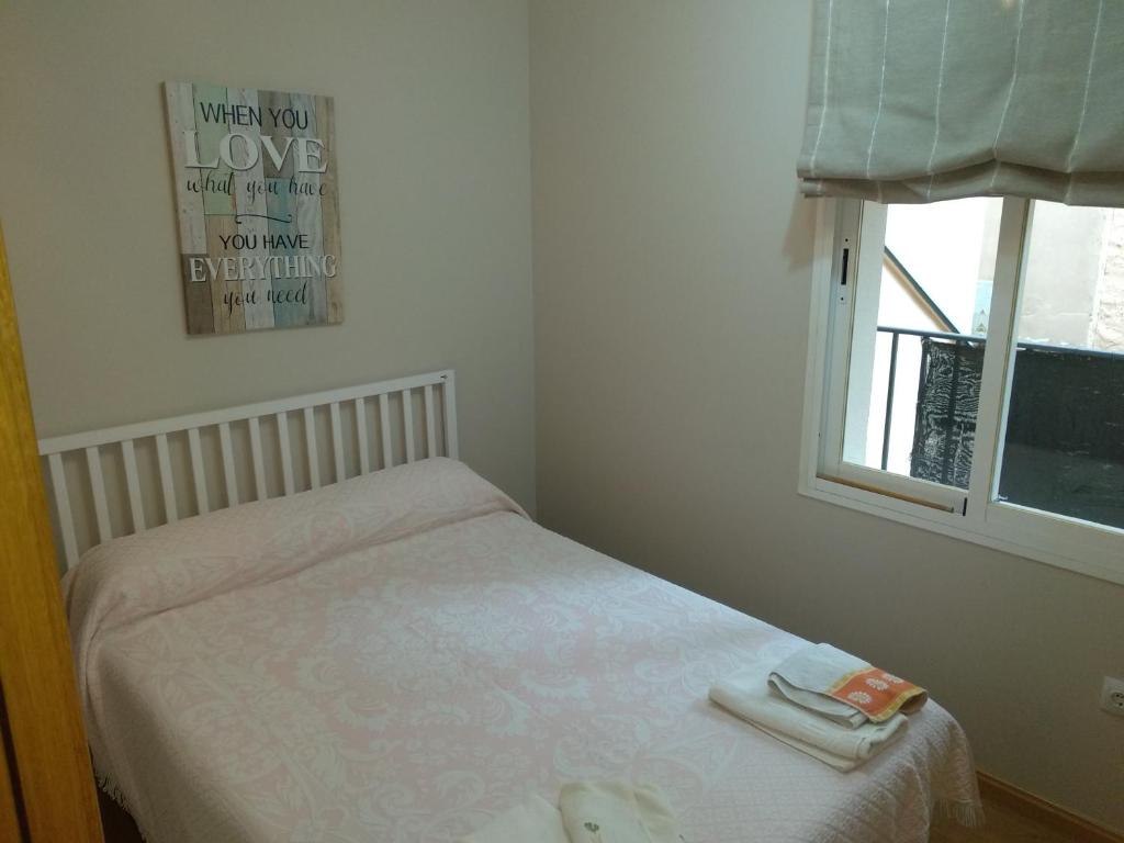 A bed or beds in a room at El Patio