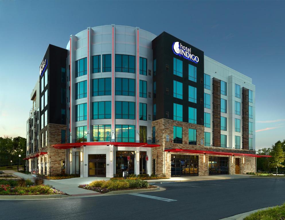 a large building with a clock on the front of it at Hotel Indigo Tuscaloosa Downtown, an IHG Hotel in Tuscaloosa
