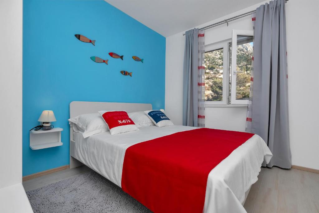 Postel nebo postele na pokoji v ubytování Villa Kapo