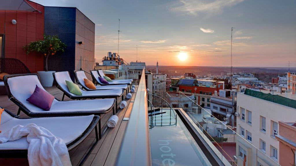 a view from a balcony overlooking the ocean at Hotel Indigo Madrid - Gran Via, an IHG Hotel in Madrid