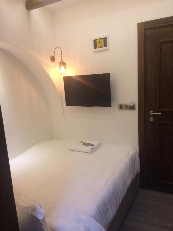 Postel nebo postele na pokoji v ubytování Mets Boutique Hotel