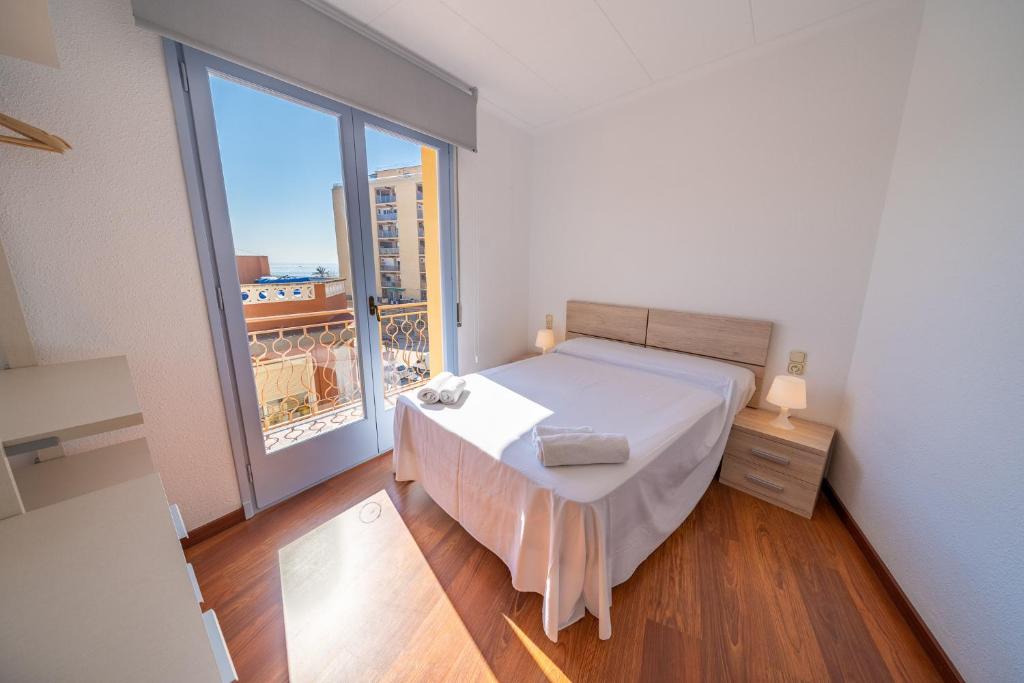 Postel nebo postele na pokoji v ubytování HomeHolidaysRentals Elodie