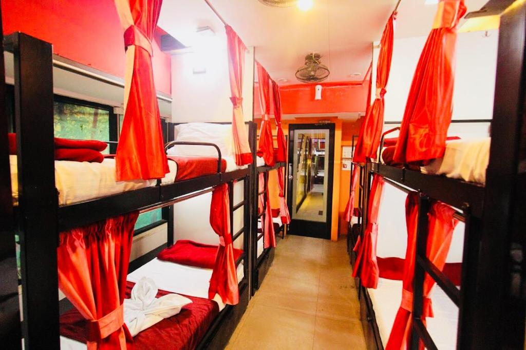 a room with four bunk beds in a train at Town Hostel Mumbai - AC Dormitory in Mumbai