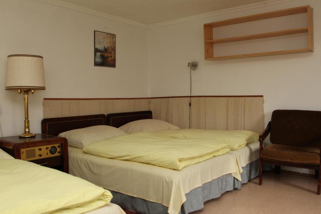Postel nebo postele na pokoji v ubytování Fülöp Vendégház