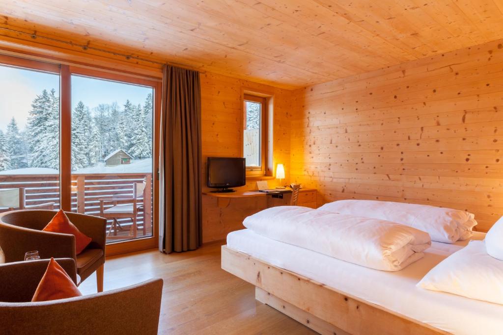 Postel nebo postele na pokoji v ubytování Biohotel Mattlihüs