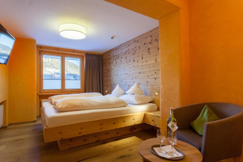 Postel nebo postele na pokoji v ubytování Biohotel Mattlihüs