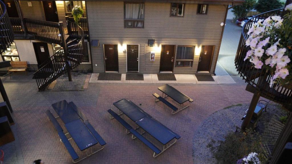 an overhead view of a group of lounge chairs in front of a building at Banff International Hostel in Banff