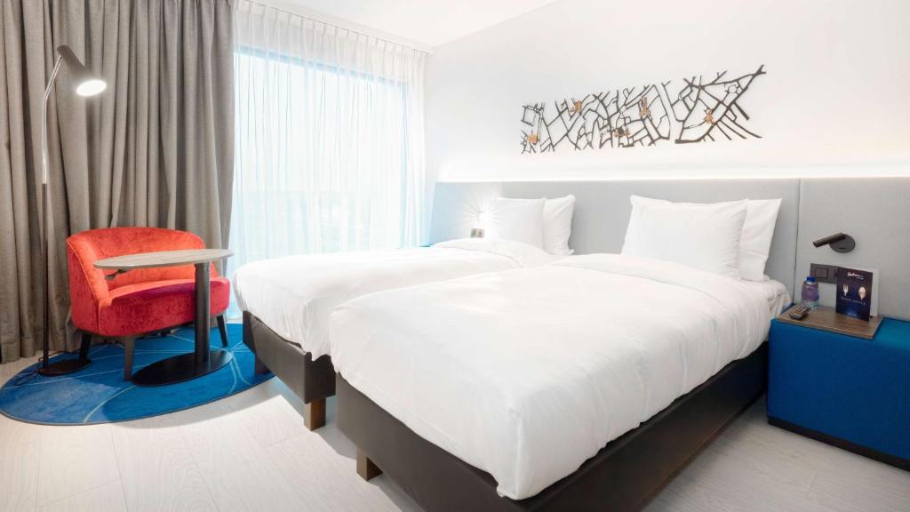 Postel nebo postele na pokoji v ubytování Radisson Blu Hotel, Bruges