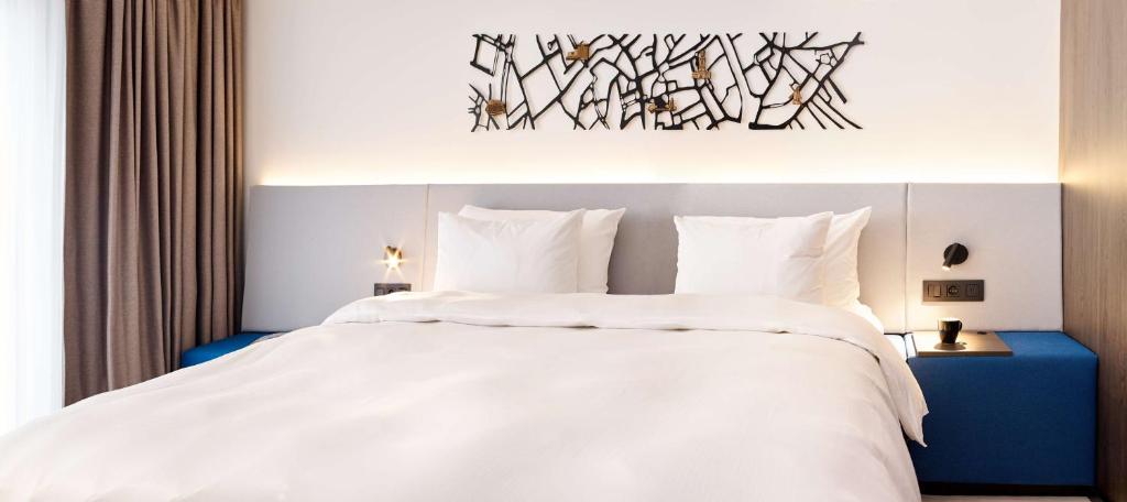 Postel nebo postele na pokoji v ubytování Radisson Blu Hotel, Bruges