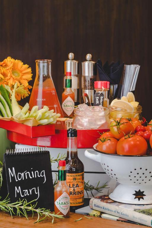 a table with a buffet of food and bottles of alcohol at Radisson Blu Hotel, Abu Dhabi Yas Island in Abu Dhabi