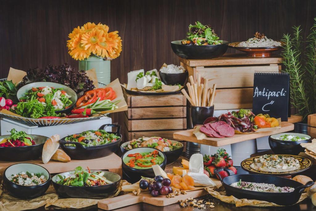 a buffet with lots of different types of food at Radisson Blu Hotel, Abu Dhabi Yas Island in Abu Dhabi