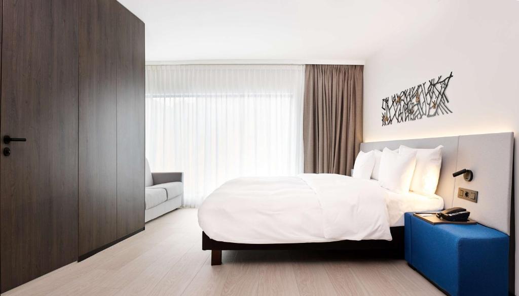 Postel nebo postele na pokoji v ubytování Radisson Blu Hotel, Bruges