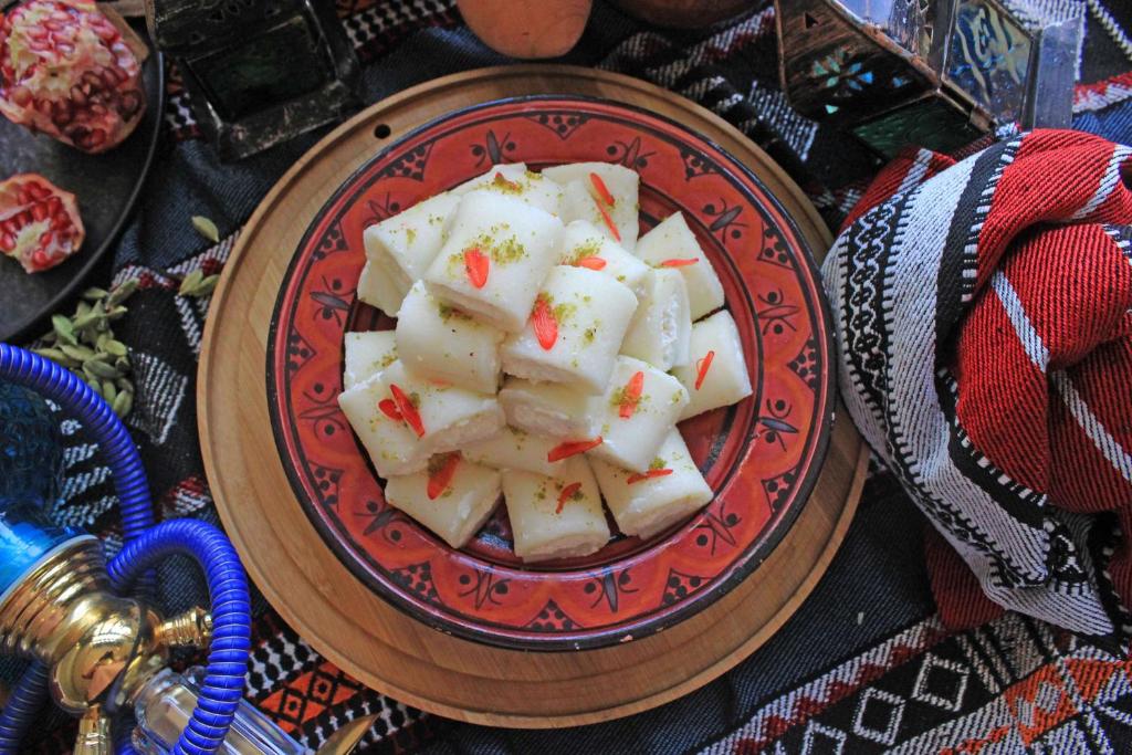 a plate of dumplings on a table at Radisson Blu Hotel, Abu Dhabi Yas Island in Abu Dhabi