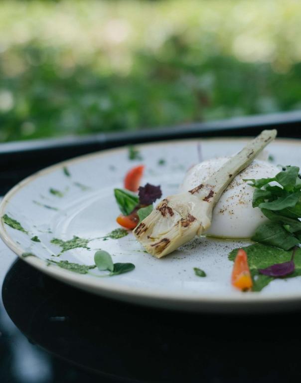 a white plate with a piece of food on it at Radisson Blu Hotel, Abu Dhabi Yas Island in Abu Dhabi