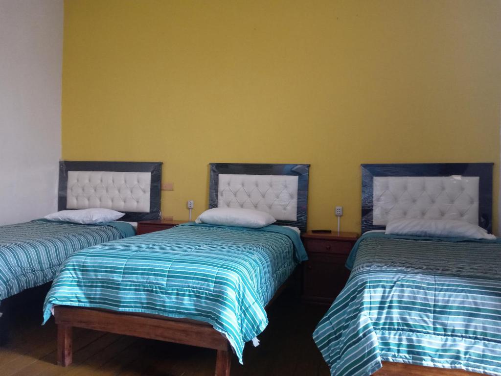 Postel nebo postele na pokoji v ubytování Misti Hostel B&B