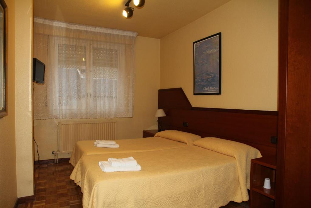 Postel nebo postele na pokoji v ubytování Pensión Acella